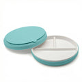 A ceramic divided plate with a blue silicone sleeve, on a white background. One plate is overturned to show the suction base. 