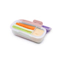 Container with compartments filled with vegetable sticks and dip on a white background