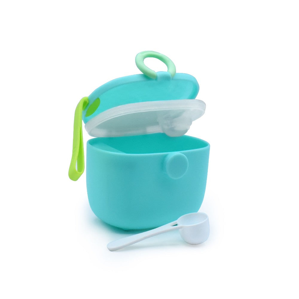 Turquoise baby formula powder container with a white spoon on a white background