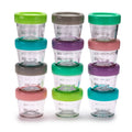 Set of clear glass containers with colorful lids on a white background