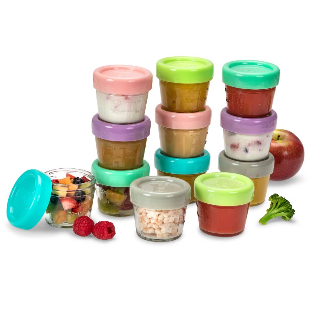 Set of colorful baby food jars with lids on a white background