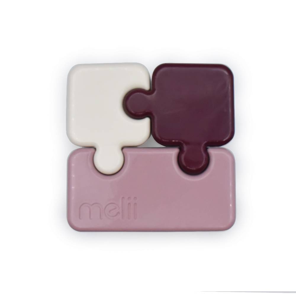 Jigsaw puzzle piece bento box with a 'melii' logo on a white background