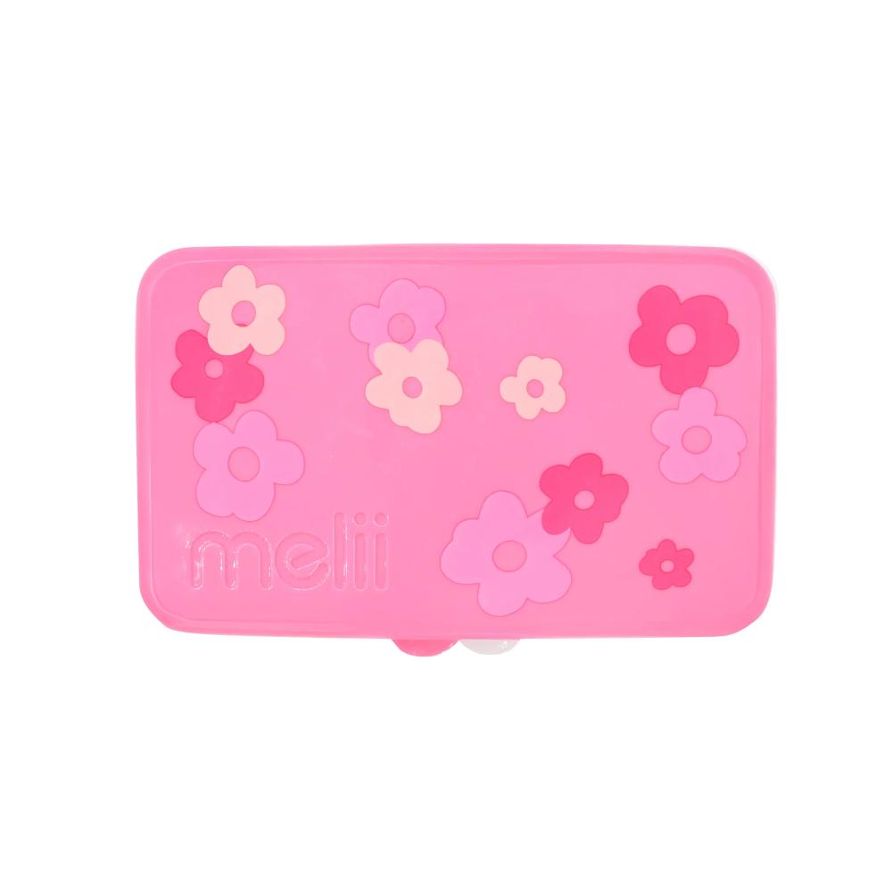 Pink kids mini snackle snack box with floral designs on a white background