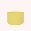 Yellow silicone drink bottle bumper on white background