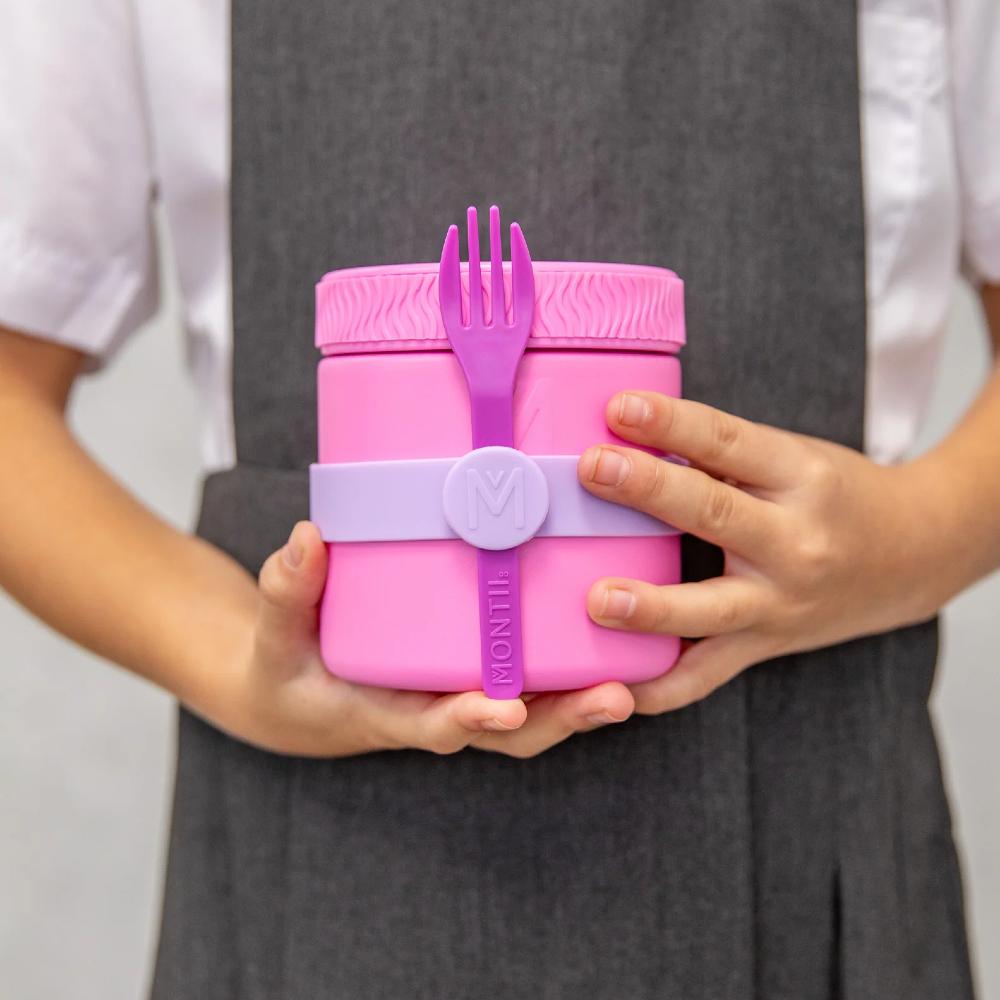 Pink lunch container with a fork held by a person