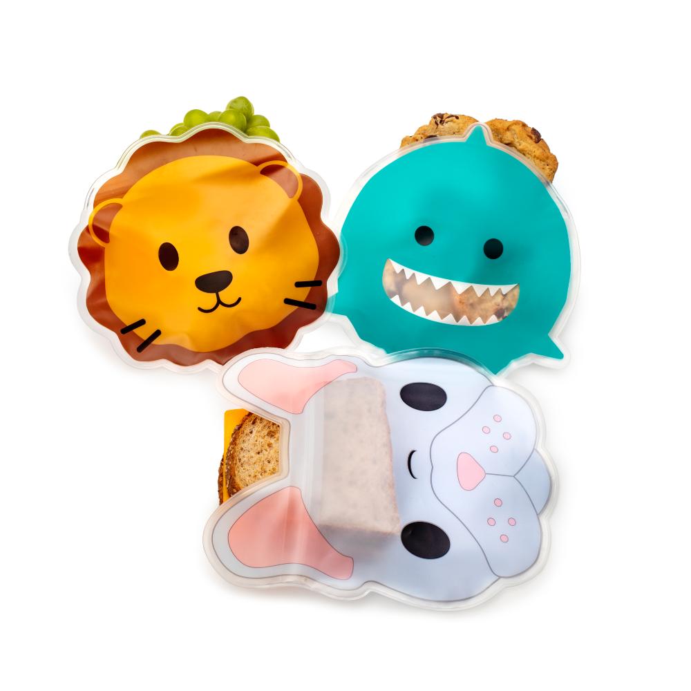 Three animal-themed lunch bags shaped like a lion, shark, and seal on a white background.