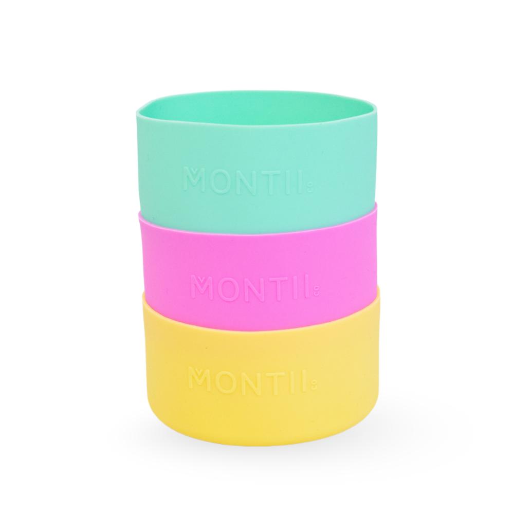 green pink and yellow large Montiico silicone bumpers for 1l bottles