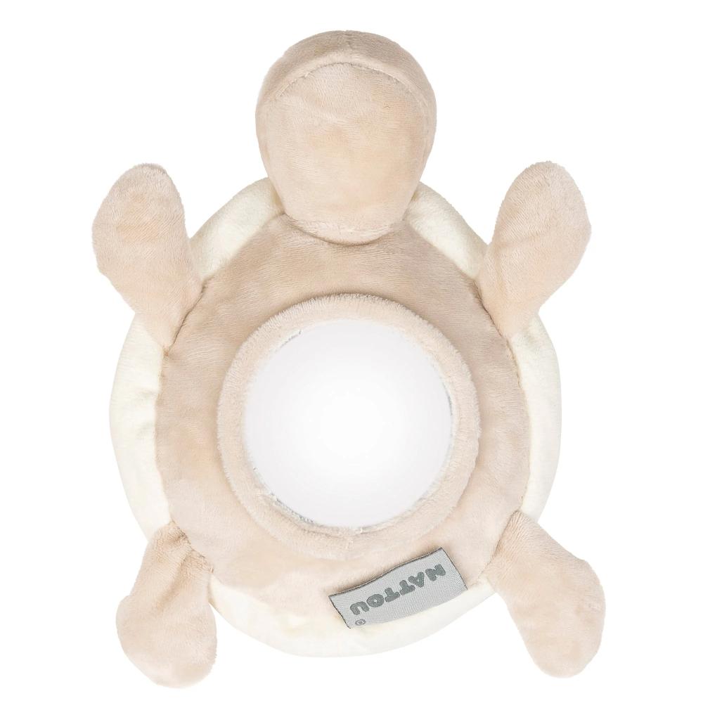 Beige plush turtle toy with a circular center and 'Nattou' label on a white background