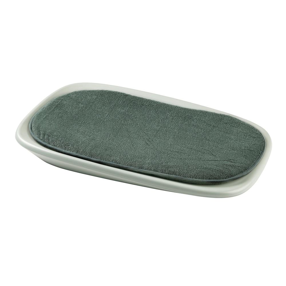 Green changing mat cover on a white background