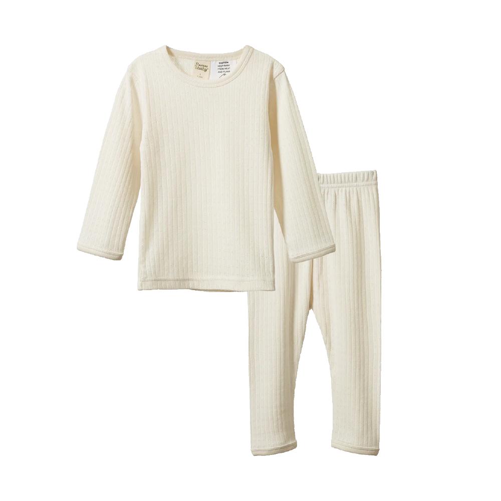 Cream-colored pointelle long sleeve pajama set on a white background
