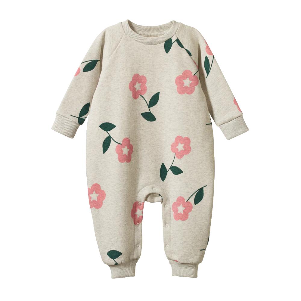Beige baby onesie with pink floral patterns with domes on the legs on a white background