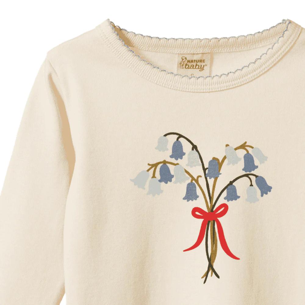 Cotton cream coloured sweater with bluebell floral and red bow design and Nature Baby branding on a white background