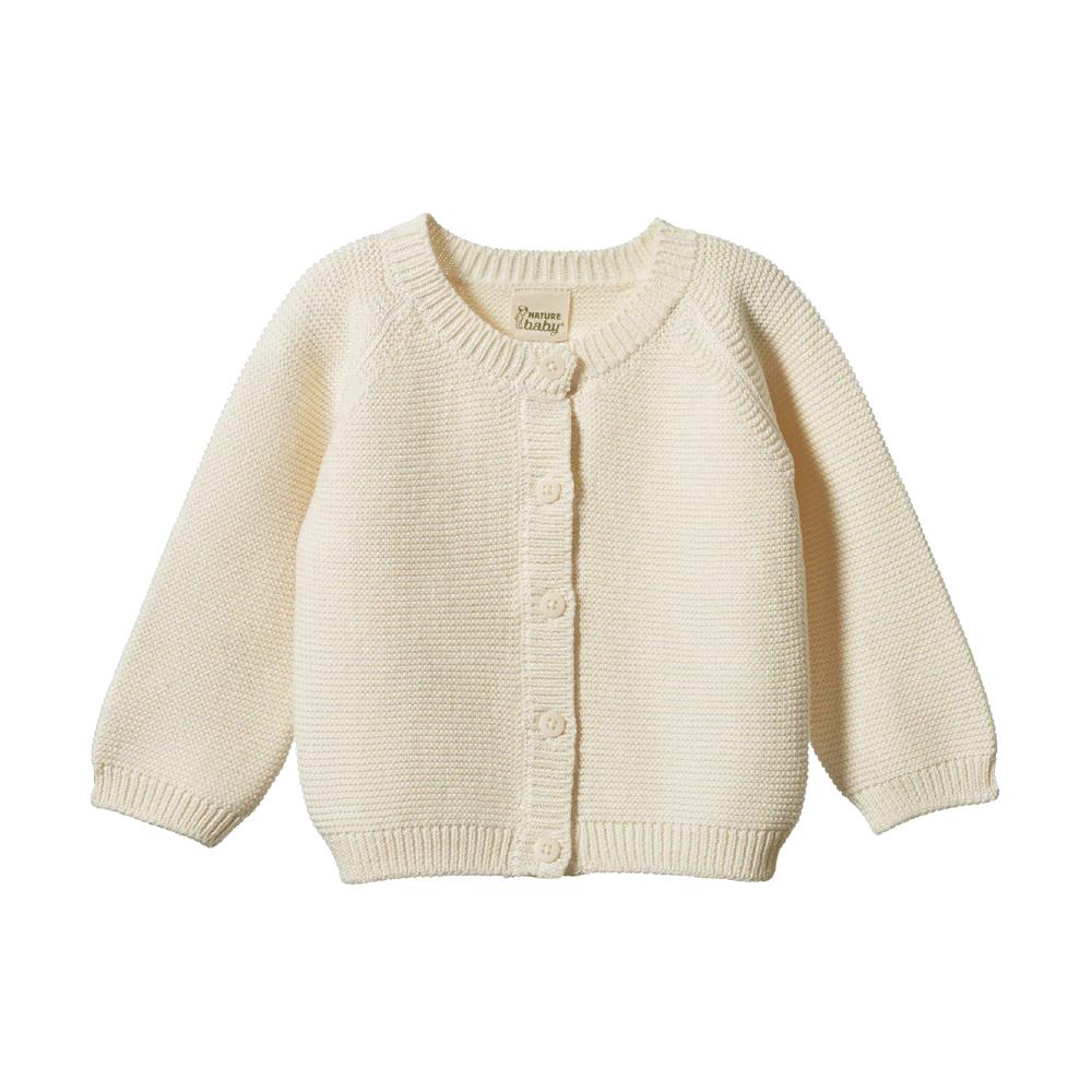 Cream coloured baby knitted cardigan with button details on a white background