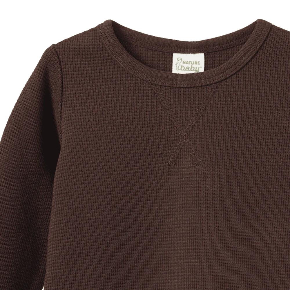 Cotton brown waffle textured shirt with a Nature Baby brand label on a white background