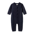 Navy blue cotton knitted baby romper with buttons on a white background