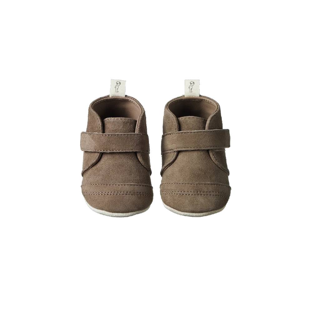 Pair of brown baby shoes with velcro straps on a white background