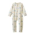 A baby long-sleeve footless one-piece sleeper in cream with a blue and gold dog print, featuring a front zipper closure.