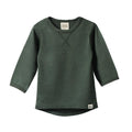 Close-up of a merino wool forest green long-sleeve shirt with envelope neck on a white background