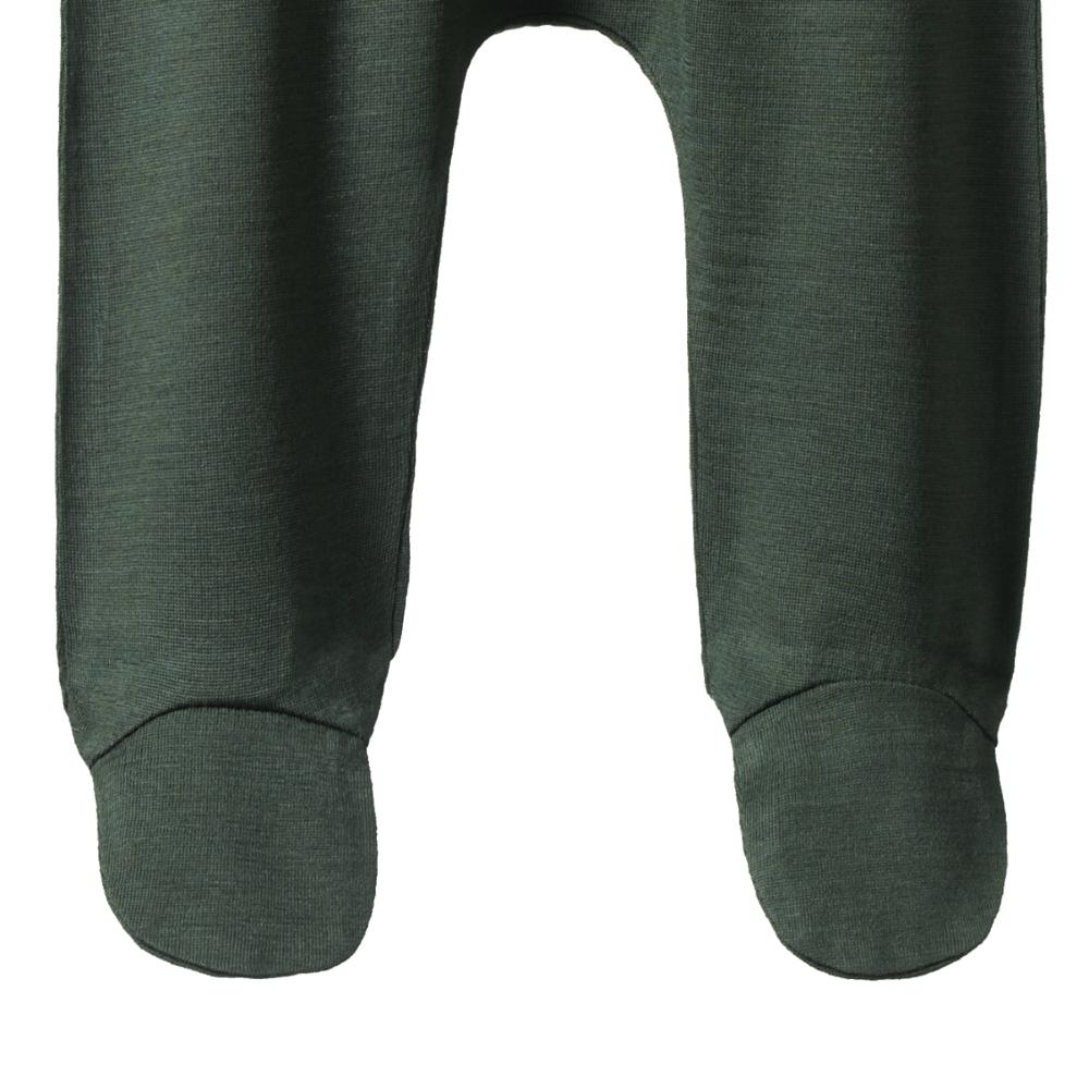 Close-up of Dark green baby footed pants in merino wool fabric n a white background