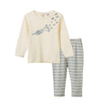 A two-piece children's pajama set featuring a cream long-sleeve top with a blue trumpet graphic and musical notes, paired with blue and white striped pants.