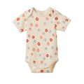 A short-sleeve cream-colored baby bodysuit with a delicate scalloped trim and an all-over pattern of small red, pink, and blue flowers, shown flat on a white background.