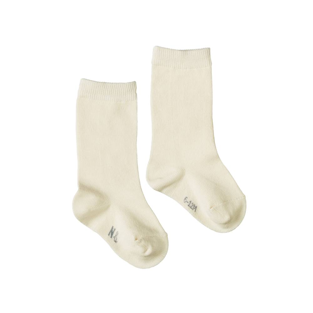 Pair of plain cotton cream coloured socks on a white background