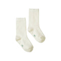 Pair of white merino rib wool socks with green 'NB' font on the foot on a white background