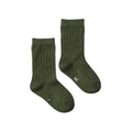 Pair of merino wool ribbed forest green socks on a white background