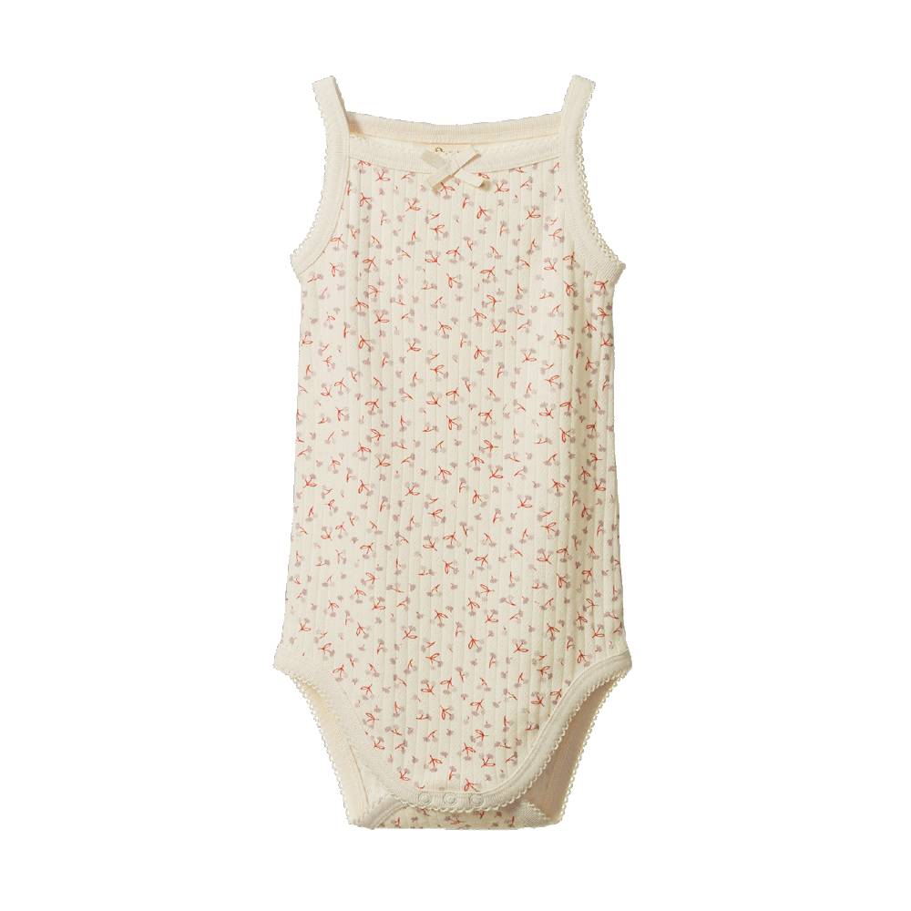 Cotton pointelle singletsuit with a cream base and floral print on a white background. 