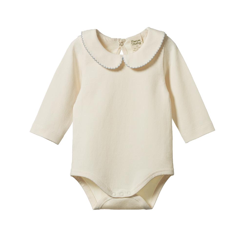 Cream-colored baby longsleeve bodysuit with a white collar with blue stitched rim on a white background