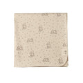 Beige cotton jersey fabric with soft bunny patterns on a white background