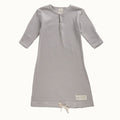 Grey and cream striped organic cotton baby gown with long sleeves and drawstring on a white background