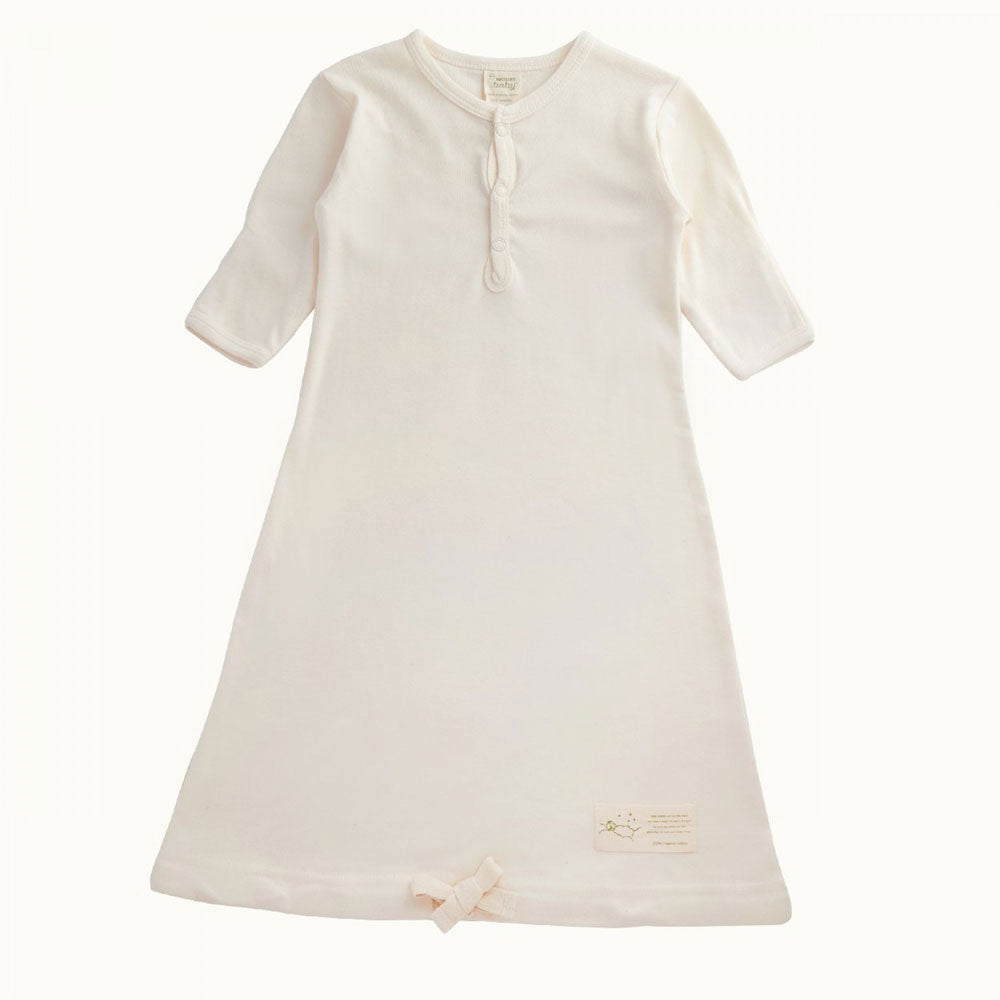 Cream coloured cotton jersey baby gown with sleeves on a white background