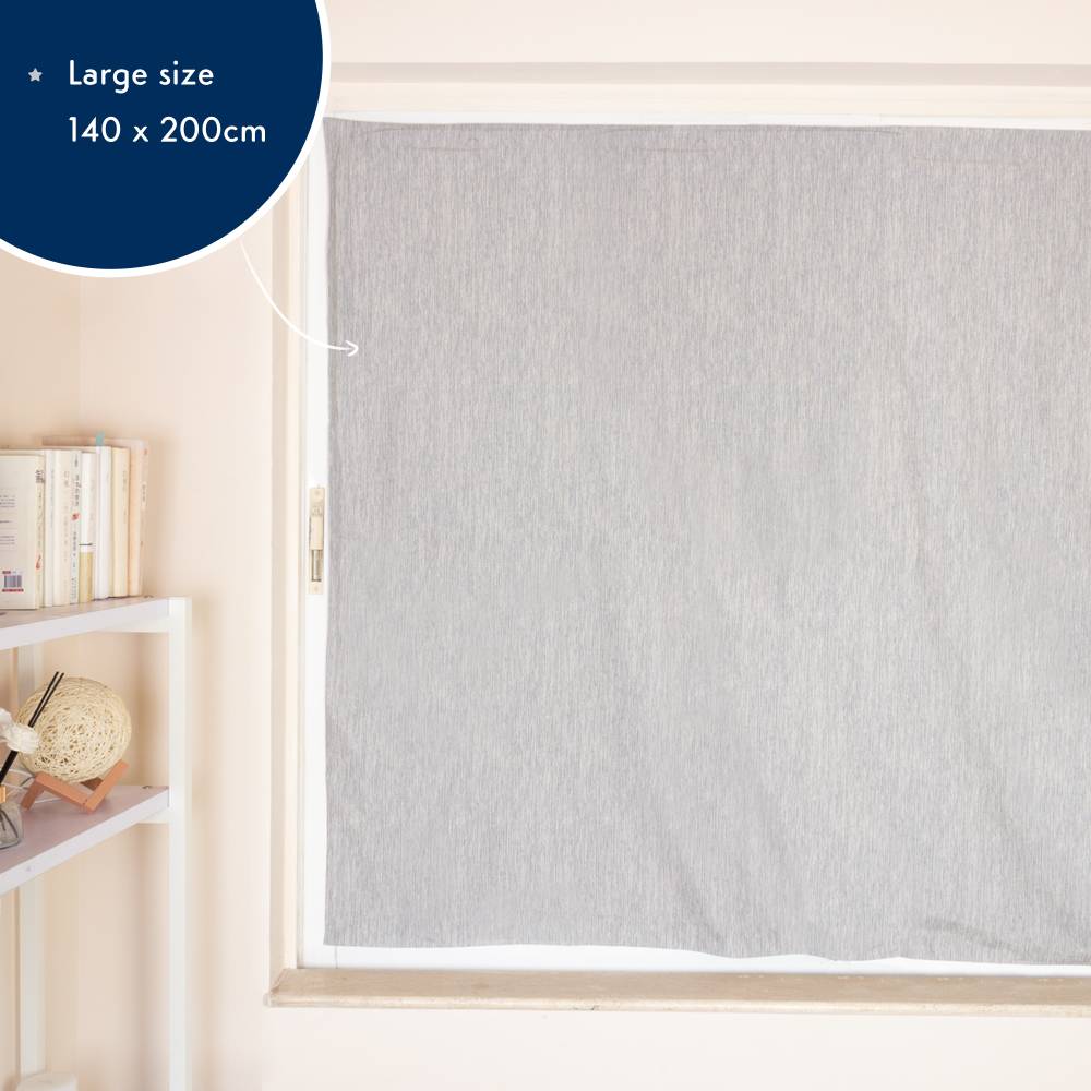 Gray suction blackout blind with size label 140 x 200cm in a room setting.