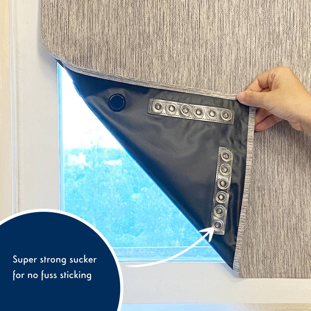 Window blind with a super strong sucker being used to attach it to a window.