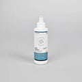 A white plastic spray bottle of Fabric Protector with a white cap and a blue and white label, centered on a light gray background.