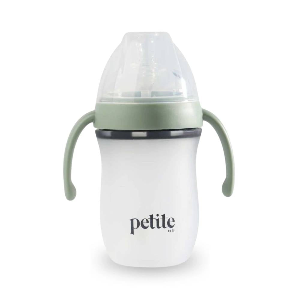 White baby bottle with green handles and 'petite eats' branding on a white background
