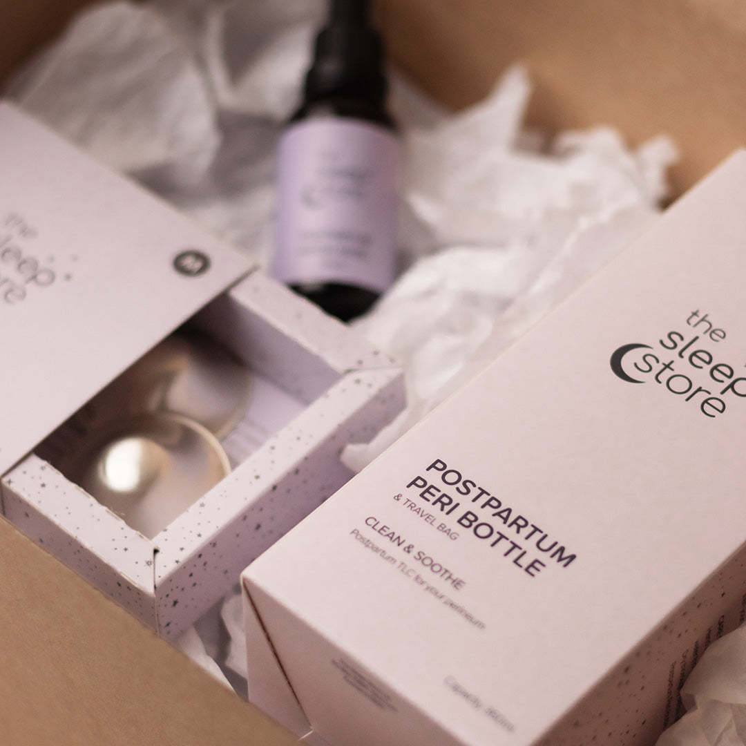 Postpartum perineum care product packaging from 'the sleep store' with a bottle and box.