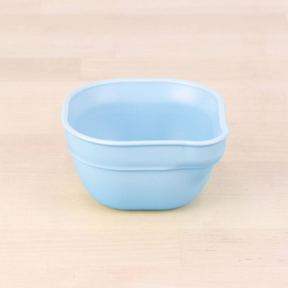 A Re-Play Dip 'n' Pour Bowl - Ice Blue on a white background