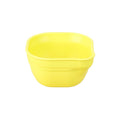 A Re-Play Dip 'n' Pour Bowl - Yellow on a white background