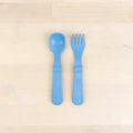 A Re-Play Fork and Spoon - Denim on a white background