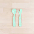 A Re-Play Fork and Spoon - Mint on a white background
