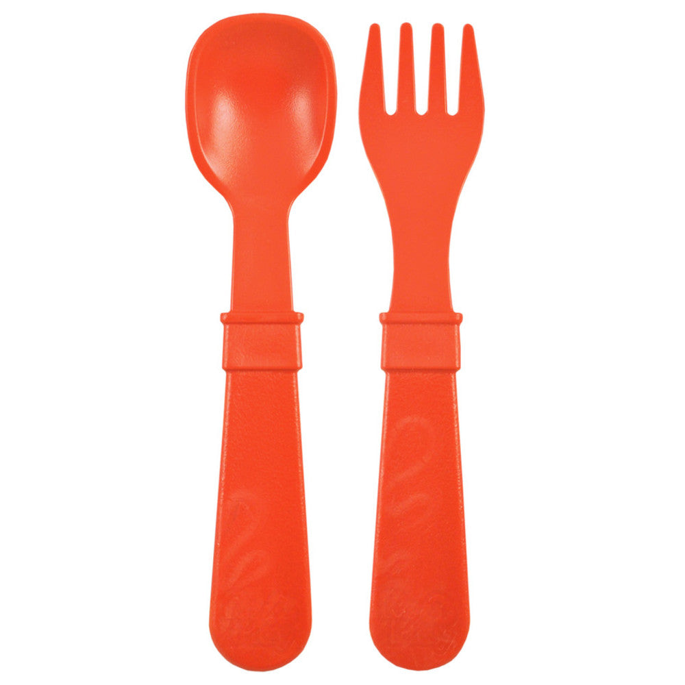 A Re-Play Fork and Spoon - Red on a white background