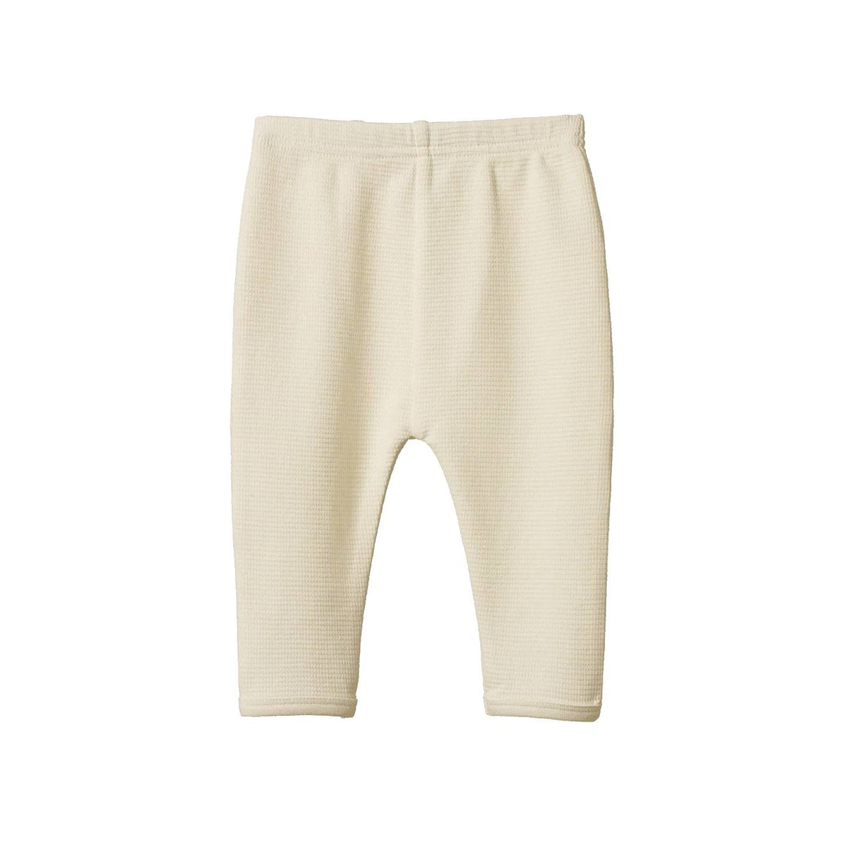 Cream waffle texture baby leggings on a white background