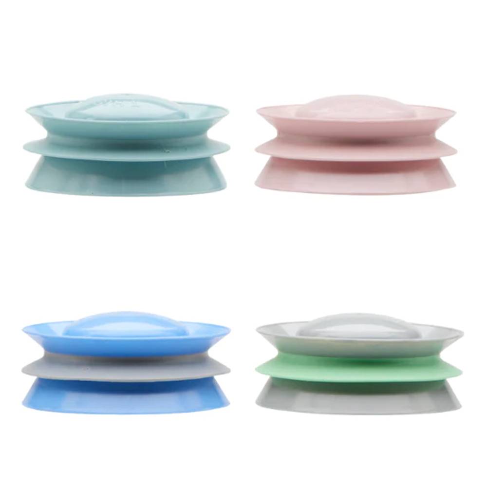 Set of four colorful silicone food bottle platform accessory parts on a white background