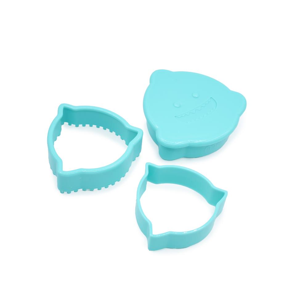 Three turquoise cookie cutters on a white background