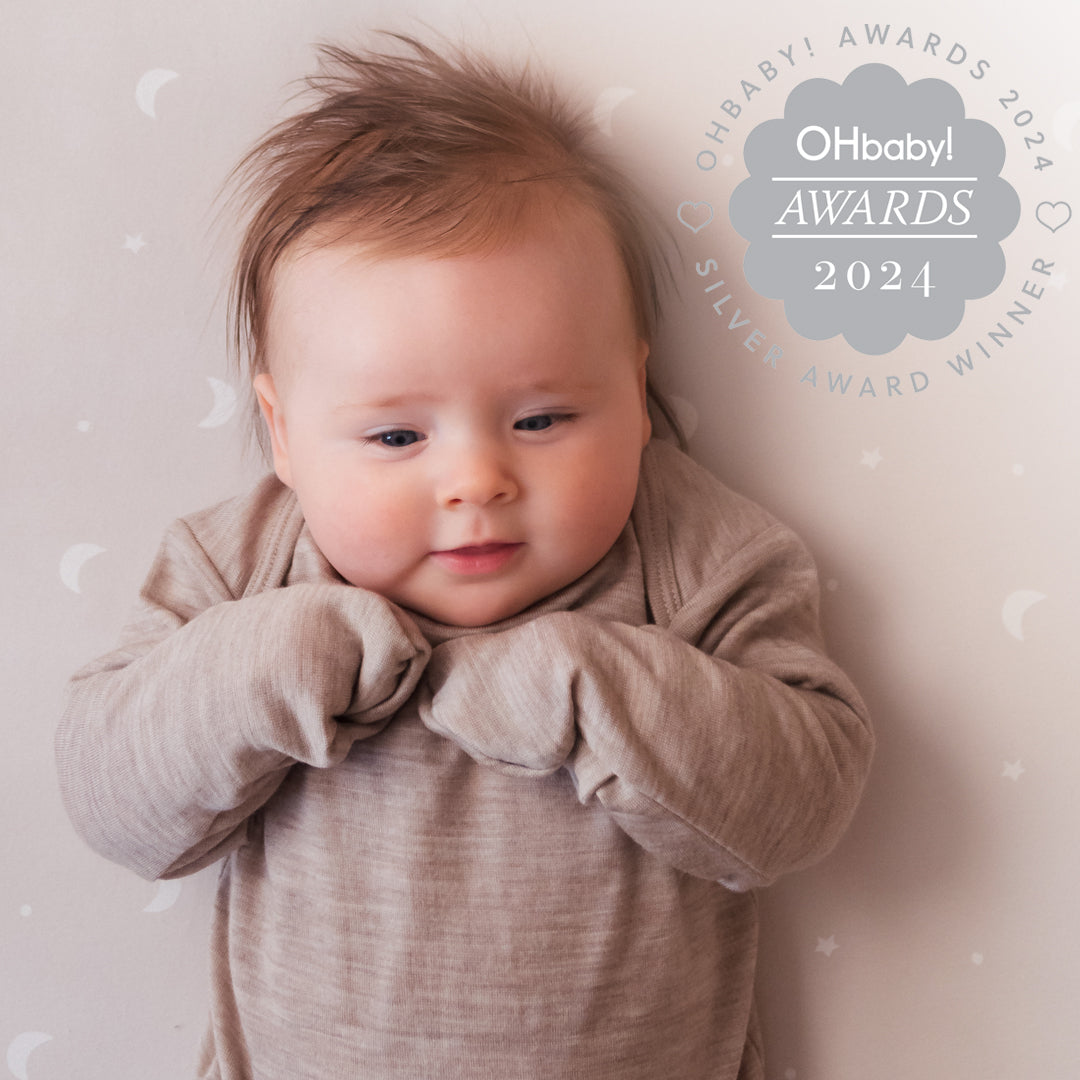 Baby wearing a beige outfit with 'OHbaby! Awards 2024' text on a light background