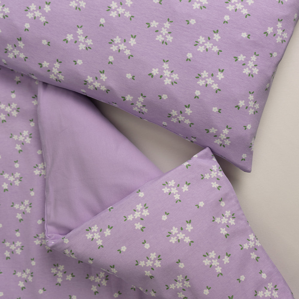 Matching duvet cover and pillowcase with lilac base and all over floral print. 