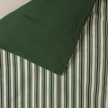 Cotton duvet cover with pine stripe print on one side and solid pine colour on the reverse side. 