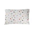 Cotton toddler pillowcase on a white background. White base with an all over farmyard print.